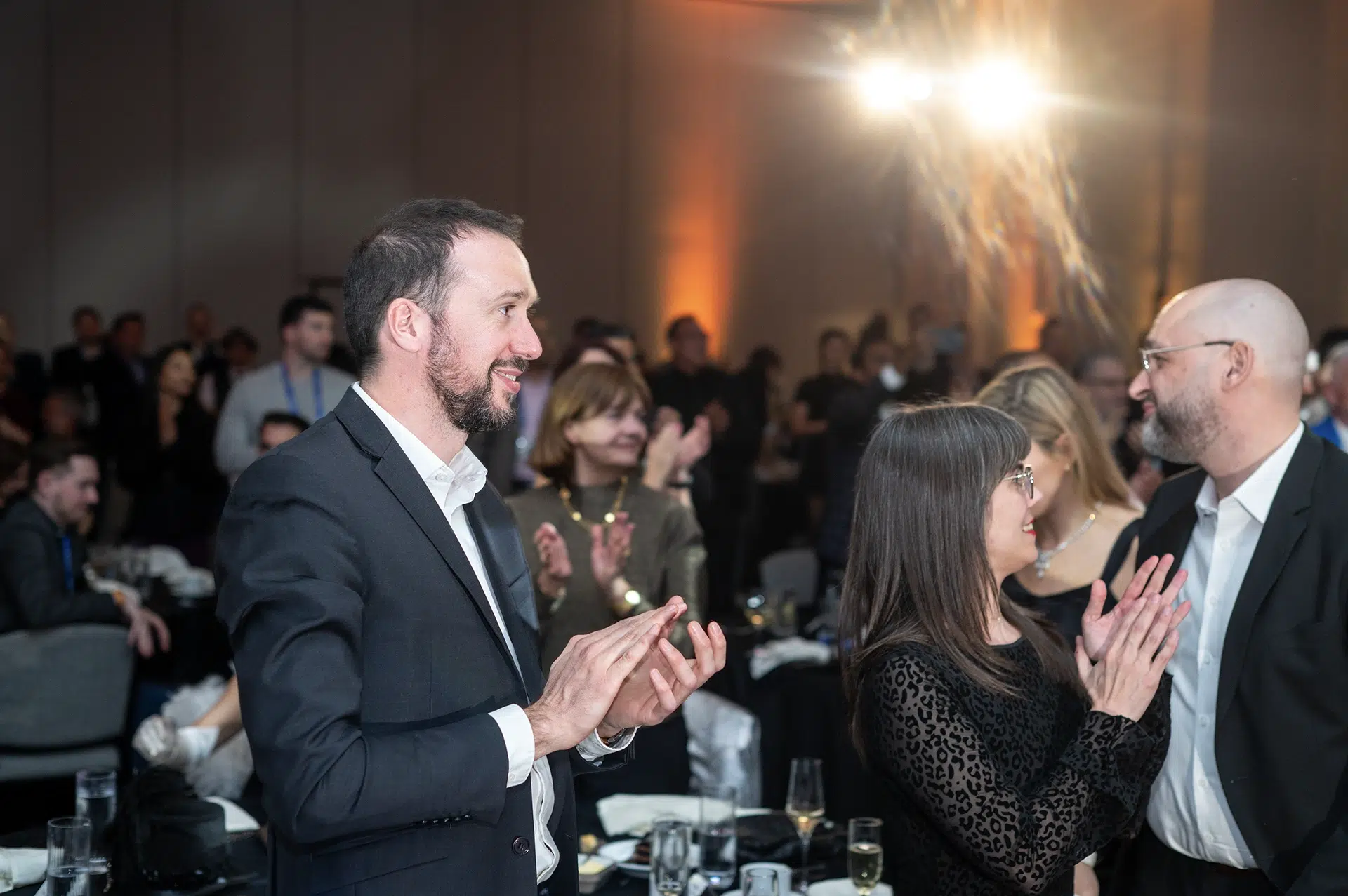 Luxury brand event photography of guests applauding during a Tiffany and Co. awards program in Los Angeles