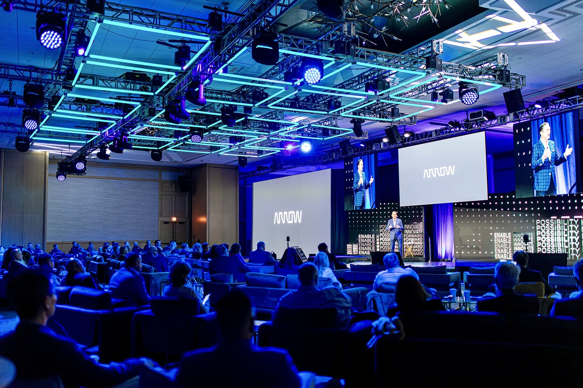 Corporate event photographer in Anaheim covering a conference general session with stage lighting